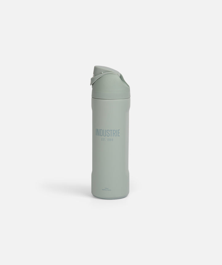 Green water bottle with 'Industrie' branding on a white background