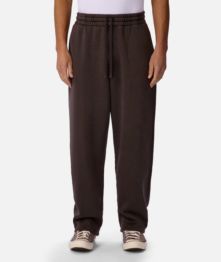 Brown pants worn by a person on a white background