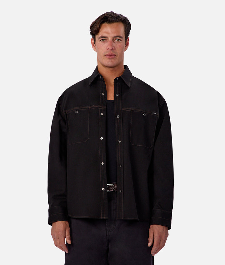Man wearing a black jacket on a white background