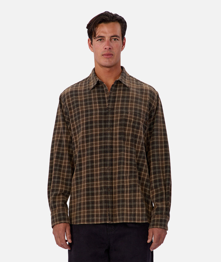 Man wearing a plaid shirt on a white background