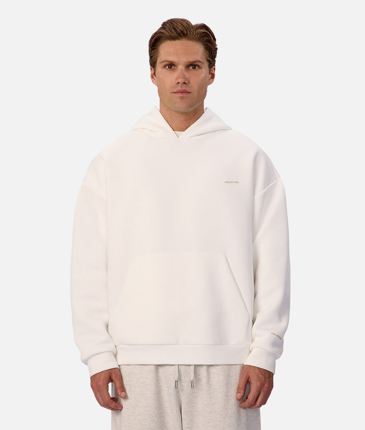 Man wearing a white hoodie on a white background