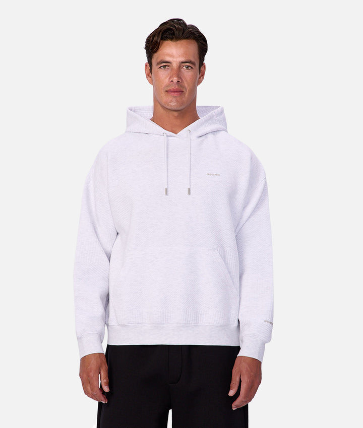 Man wearing a white hoodie on a white background