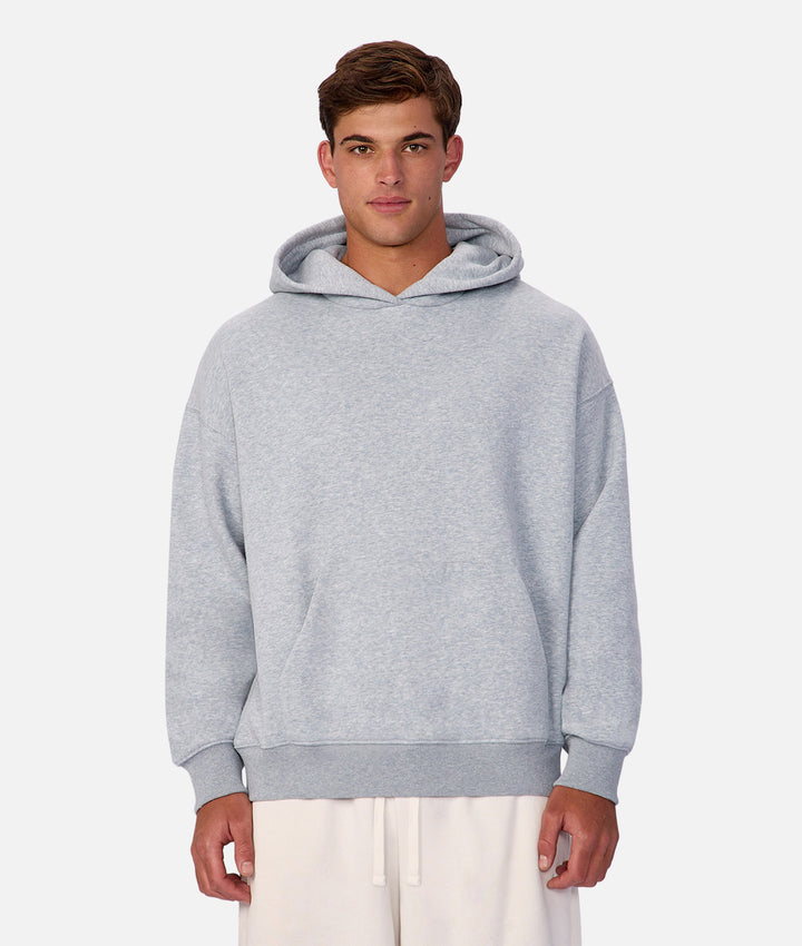 Man wearing a gray hoodie on a white background