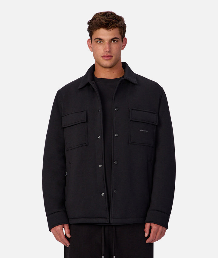 Man wearing a black jacket on a white background