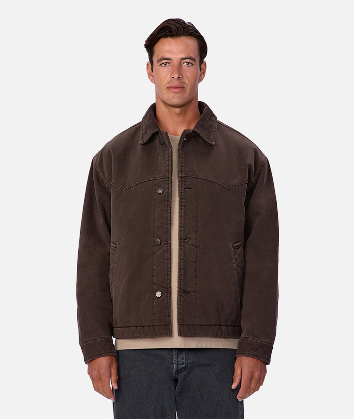 Man wearing a brown jacket on a white background