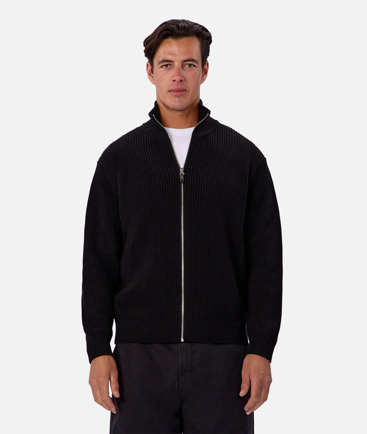 Man wearing a black textured jacket on a white background
