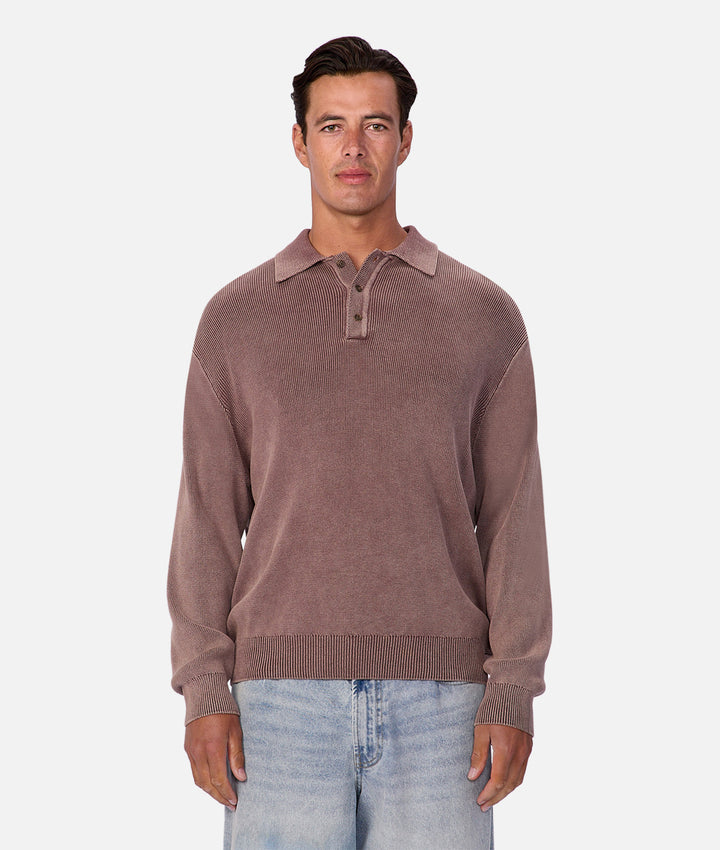 Man wearing a brown sweater with a collar on a white background