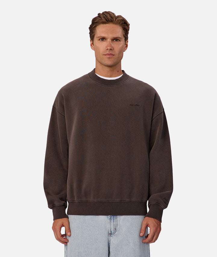 Man wearing a brown sweatshirt on a white background