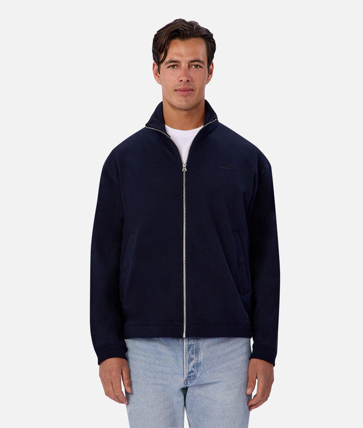 Man wearing a navy blue jacket on a white background